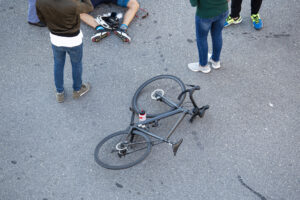 bicyclist attended to on the ground